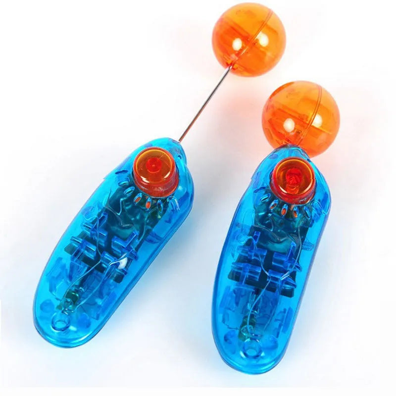 Blue plastic dog training clicker on a light surface for pet obedience training