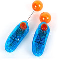 Blue plastic dog training clicker on a light surface for pet obedience training