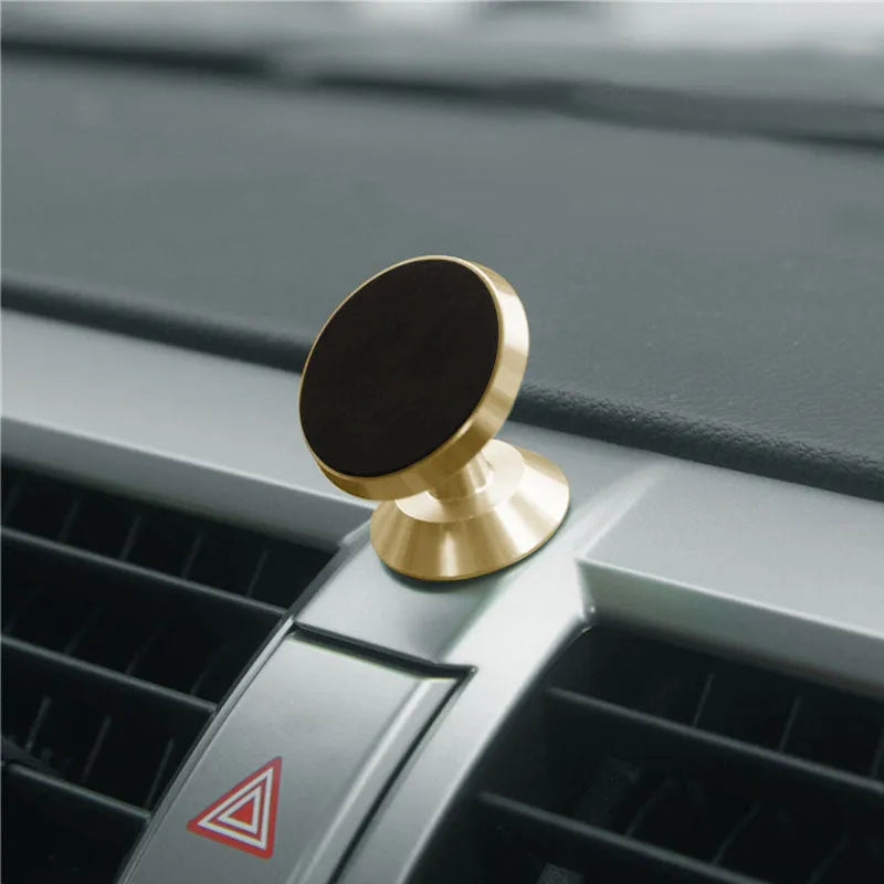 Universal magnetic car phone holder with circular base in black, silver, and gold colour options
