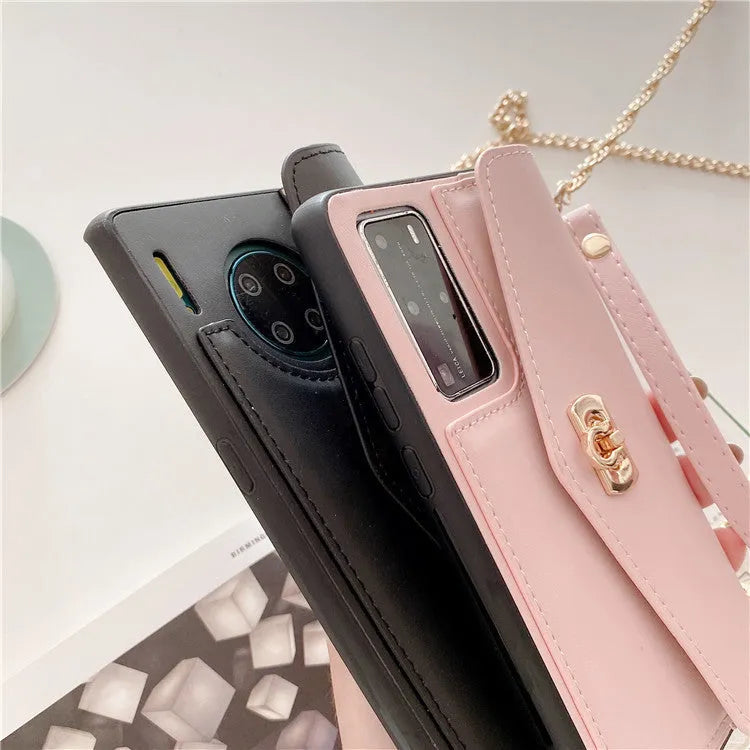 Pink imitation leather Huawei phone case with handbag pattern and gold chain, fitted to a phone.