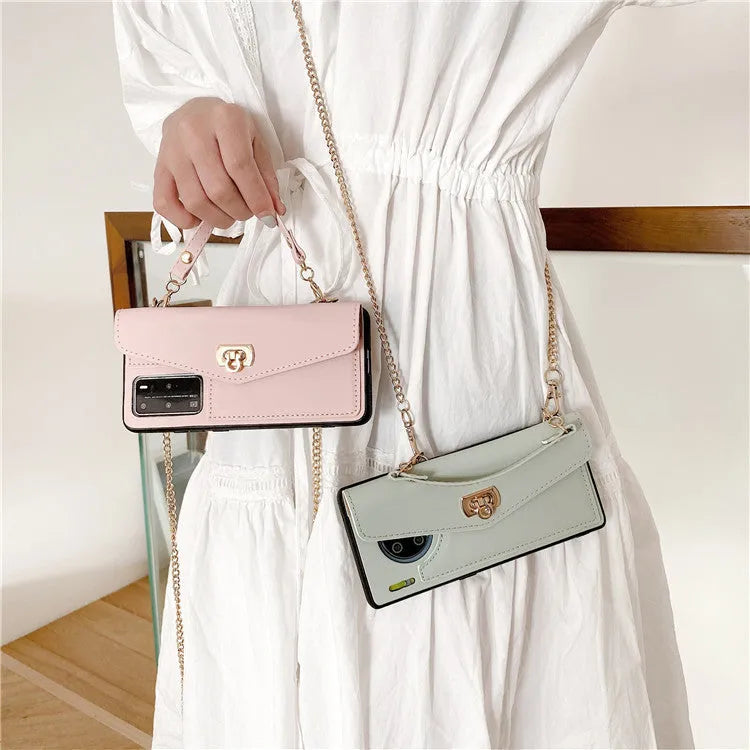 Pink imitation leather Huawei phone case with handbag pattern and gold chain, fitted to a phone.