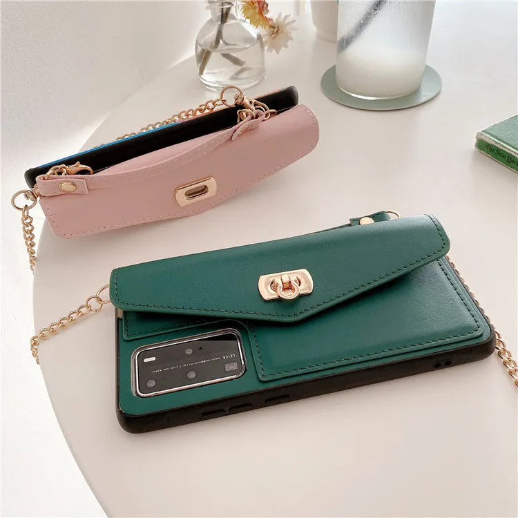Pink imitation leather Huawei phone case with handbag pattern and gold chain, fitted to a phone.