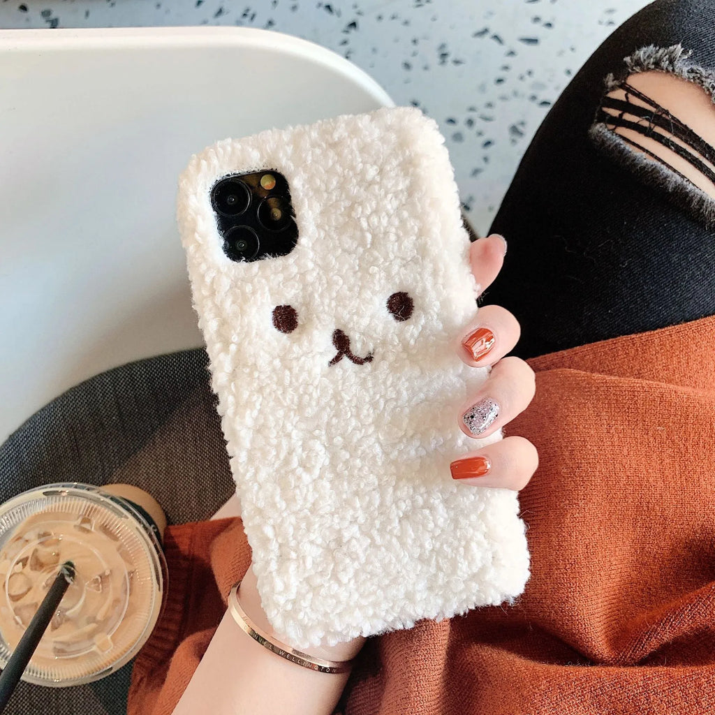 Soft brown TPU iPhone case with an embroidered plush cartoon bear face design on the back.