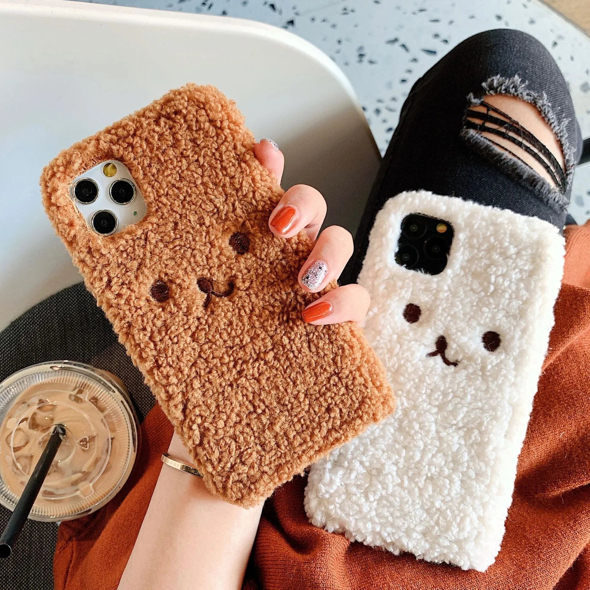 Soft brown TPU iPhone case with an embroidered plush cartoon bear face design on the back.