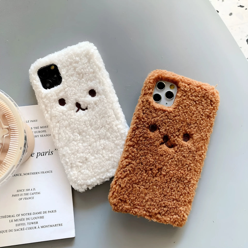 Soft brown TPU iPhone case with an embroidered plush cartoon bear face design on the back.
