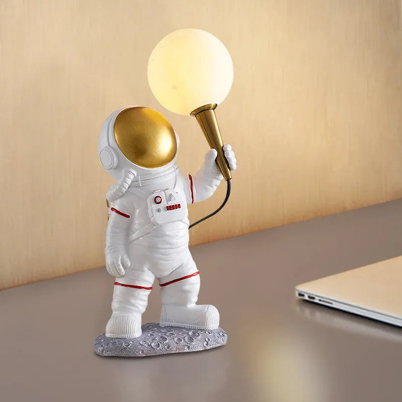 White astronaut desk lamp in three styles: seated, standing, and wall-mounted children's night light