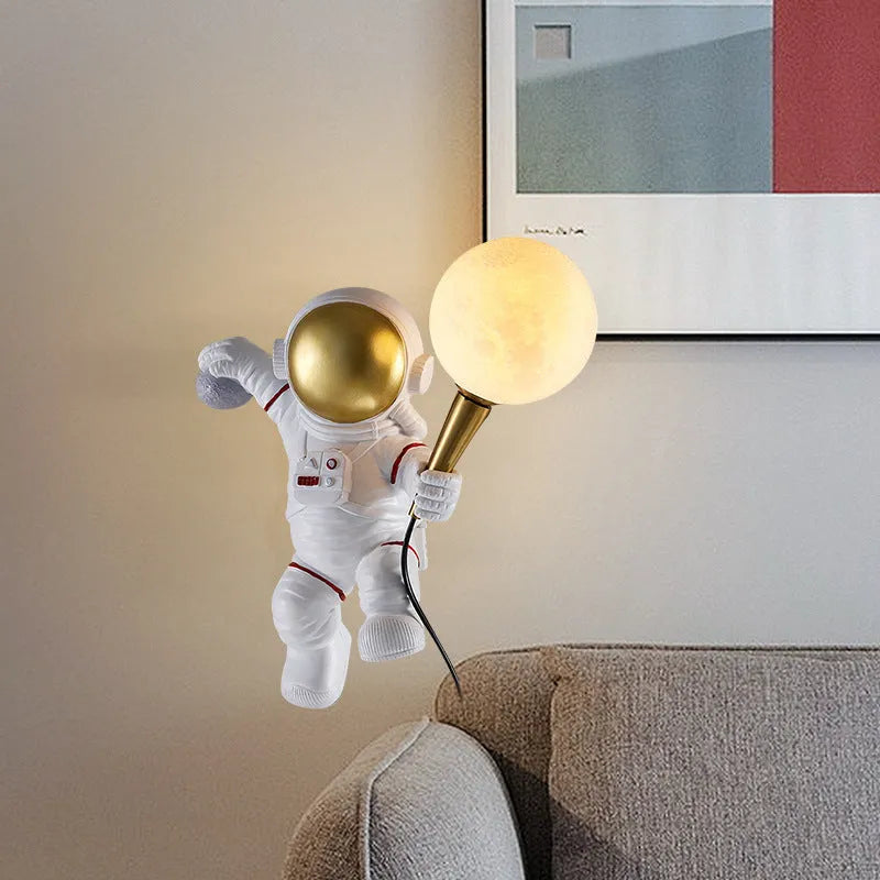 White astronaut desk lamp in three styles: seated, standing, and wall-mounted children's night light