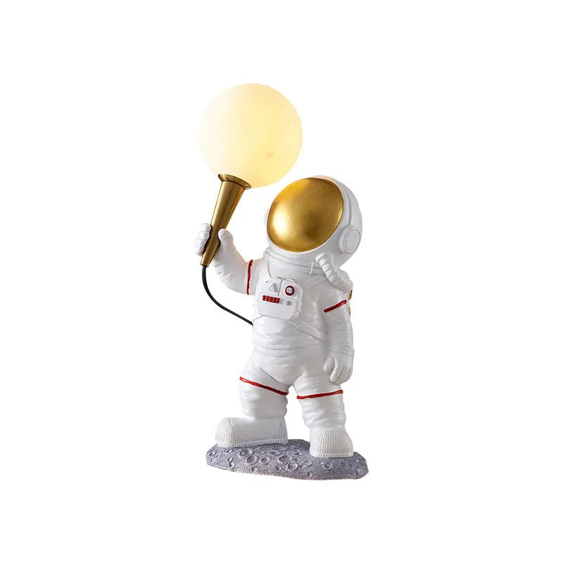White astronaut desk lamp in three styles: seated, standing, and wall-mounted children's night light
