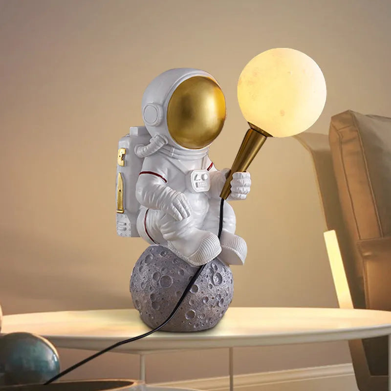 White astronaut desk lamp in three styles: seated, standing, and wall-mounted children's night light