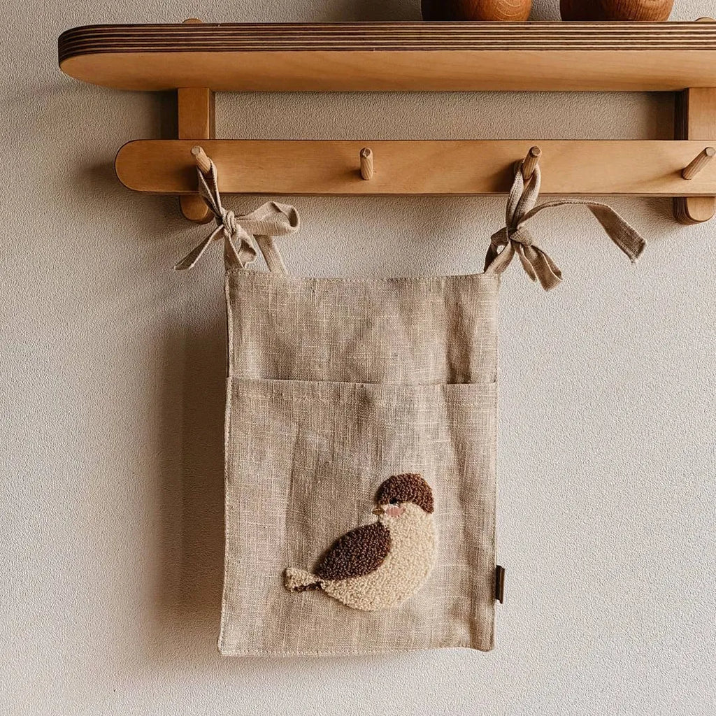 Khaki cotton linen hanging storage bag with single pocket designed for bedside organisation