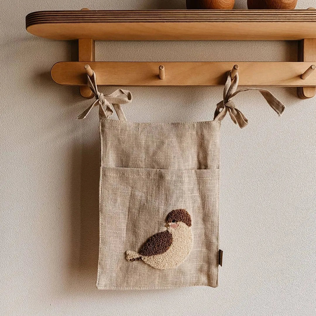 Khaki cotton linen hanging storage bag with single pocket designed for bedside organisation