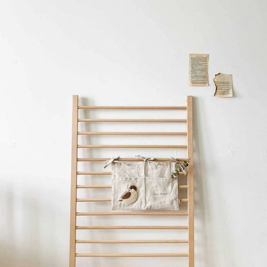 Khaki cotton linen hanging storage bag with single pocket designed for bedside organisation
