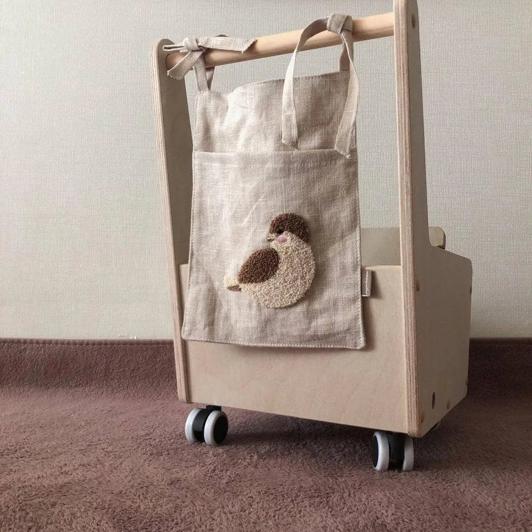 Khaki cotton linen hanging storage bag with single pocket designed for bedside organisation