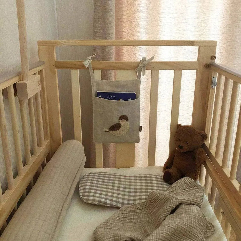 Khaki cotton linen hanging storage bag with single pocket designed for bedside organisation