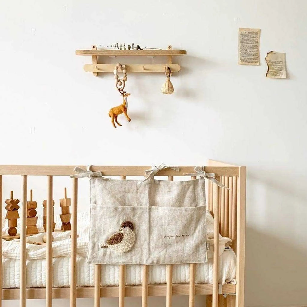 Khaki cotton linen hanging storage bag with single pocket designed for bedside organisation