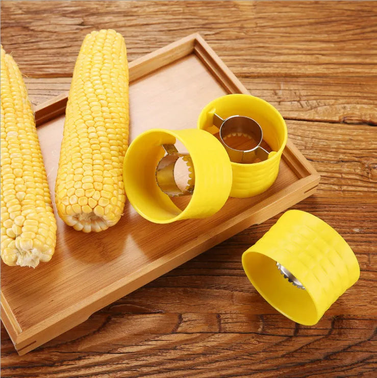 Yellow manual corn grinder thresher with corn-shaped design and stainless steel peeling gear.