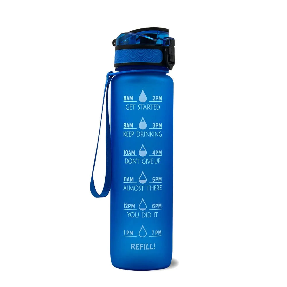 Blue and red gradient 1 litre Tritan sports water bottle with time markers and a black flip-top lid.