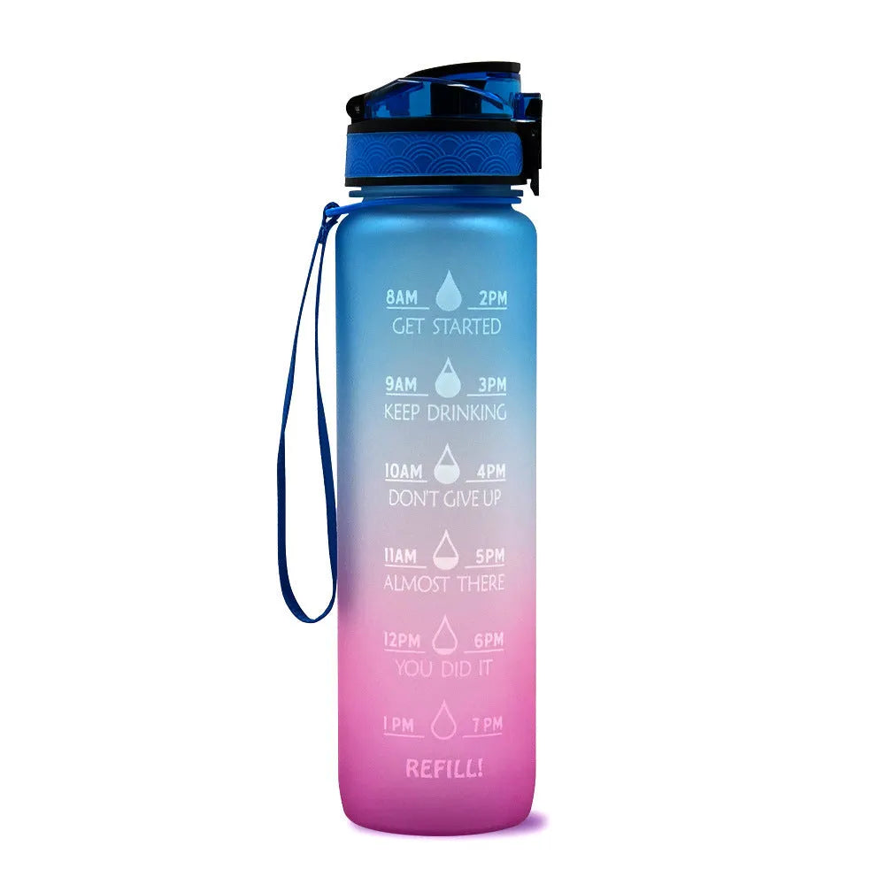 Blue and red gradient 1 litre Tritan sports water bottle with time markers and a black flip-top lid.
