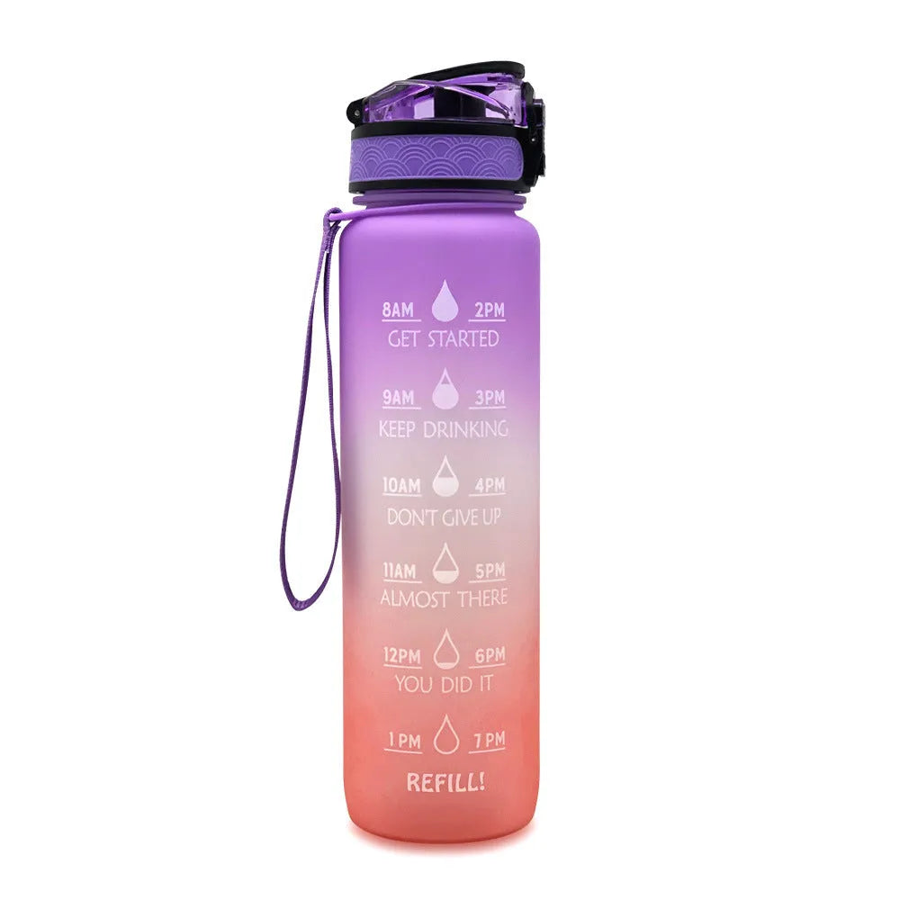Blue and red gradient 1 litre Tritan sports water bottle with time markers and a black flip-top lid.