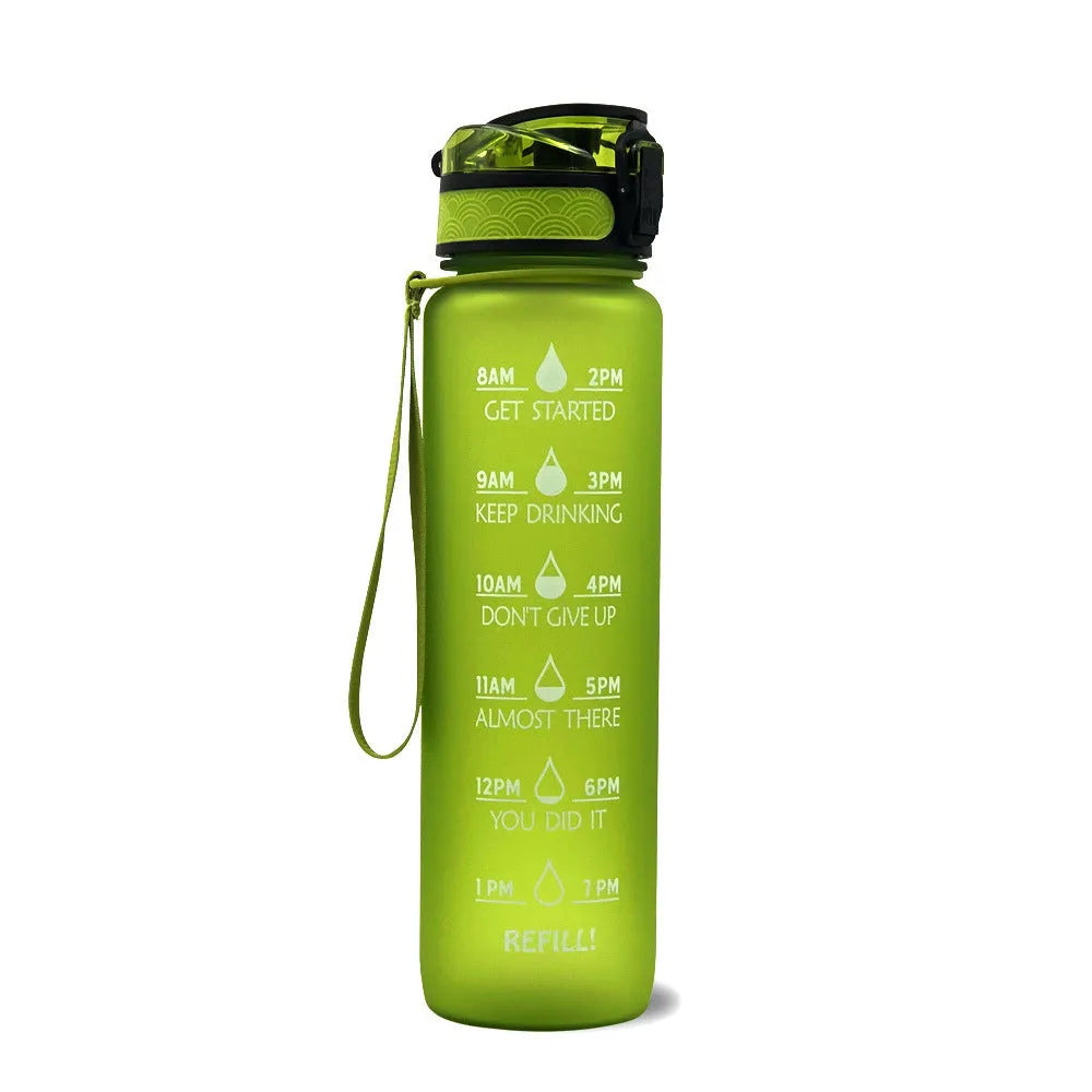 Blue and red gradient 1 litre Tritan sports water bottle with time markers and a black flip-top lid.