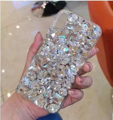 Clear soft-edge iPhone case with crystal rhinestone gem design on back