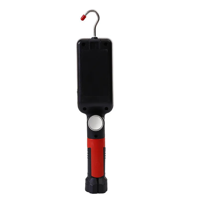 Red USB rechargeable COB LED flashlight with magnetic base shown on a metal surface.