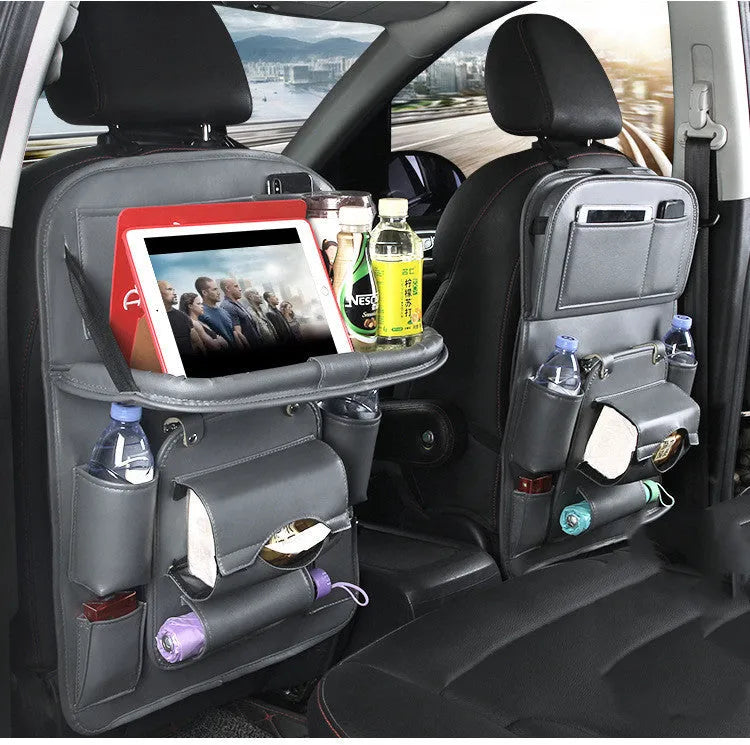 Black PU leather car storage hanging bag with multiple pockets on a car seat.