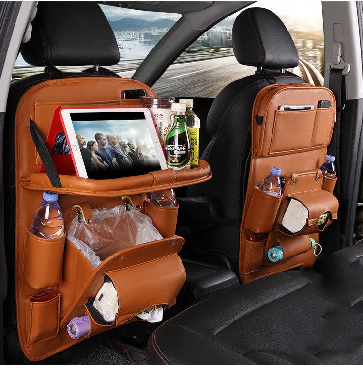 Black PU leather car storage hanging bag with multiple pockets on a car seat.