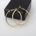 Geometric metal earring for women in gold with simple design and electroplated finish