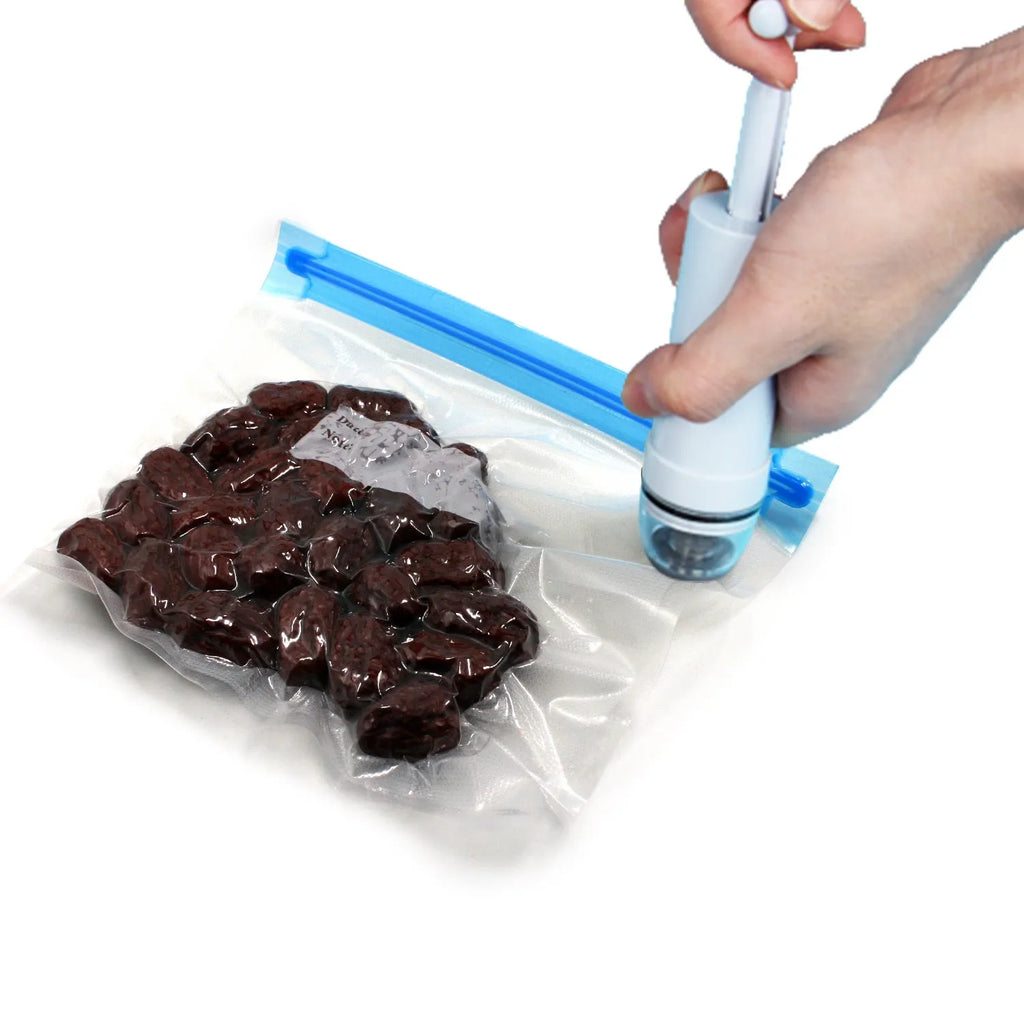 Green and grey manual vacuum compression storage bag with hand pump for space saving