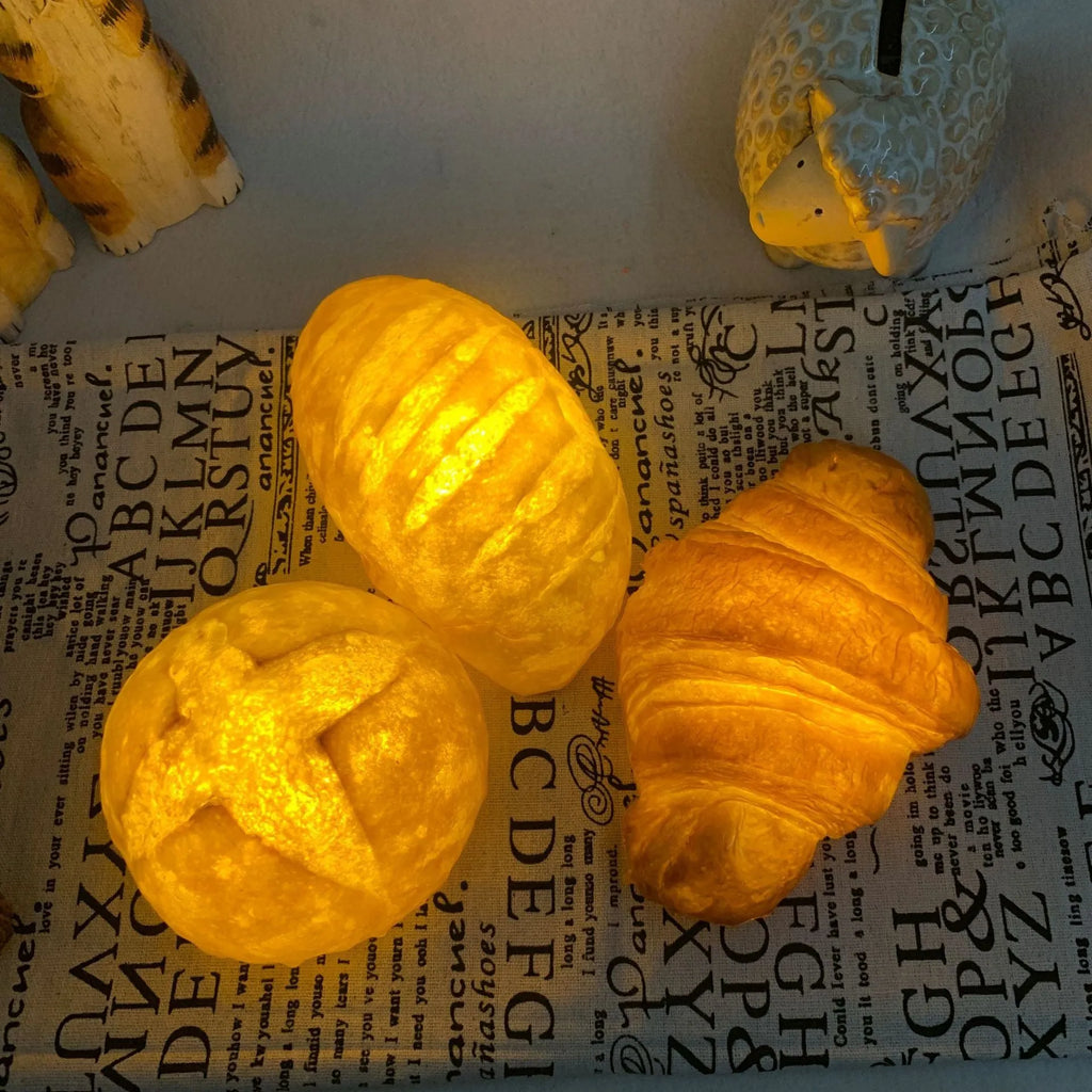 Creative croissant-shaped LED night light with milk bag decoration, modern minimalist design