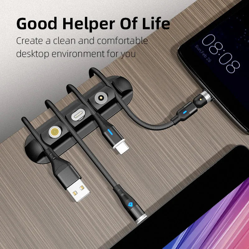 Black soft plastic desktop stand organiser for a magnetic charging cable.