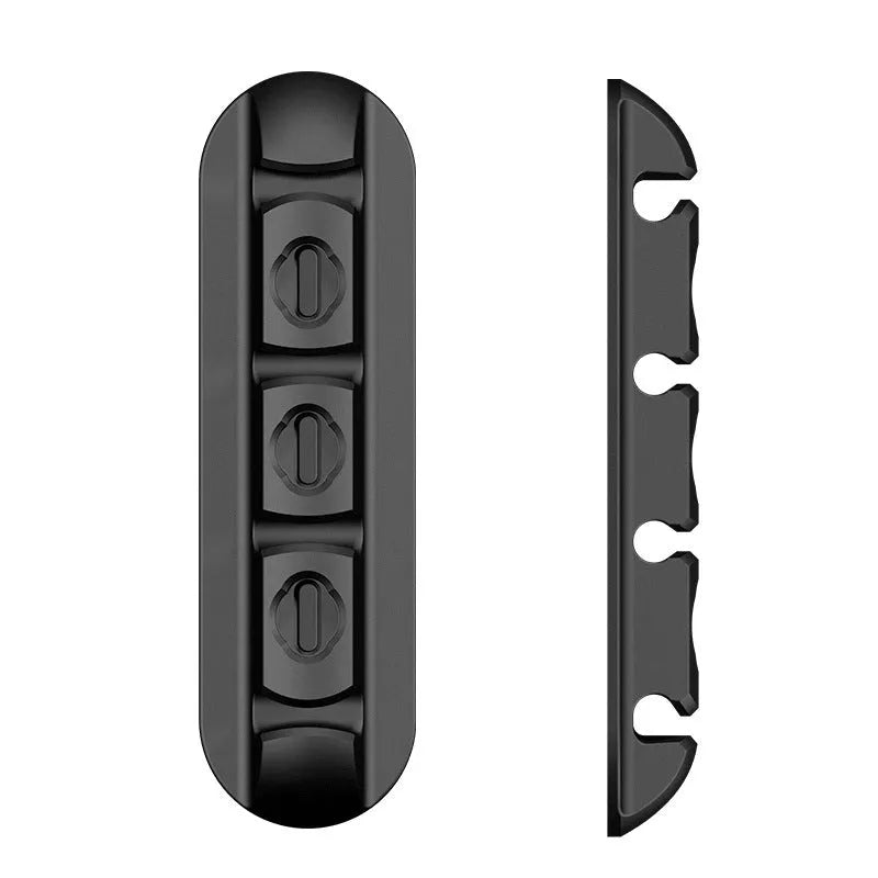 Black soft plastic desktop stand organiser for a magnetic charging cable.