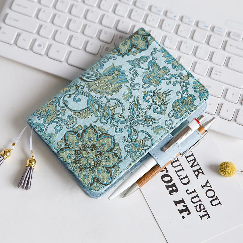 Fabric cover notebook with flying blue flower pattern showing A5 and A6 size options