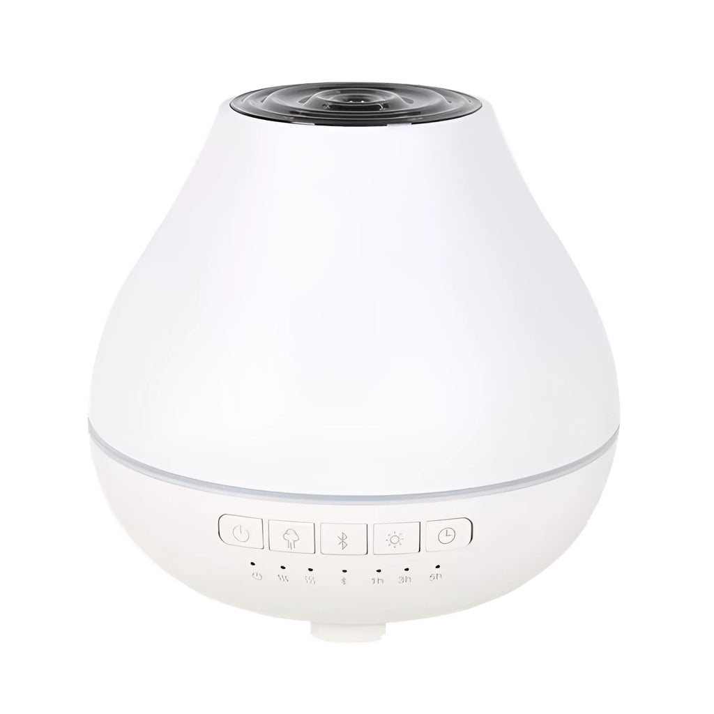 Round white Bluetooth aroma diffuser and humidifier with a colour-changing night light on a table.