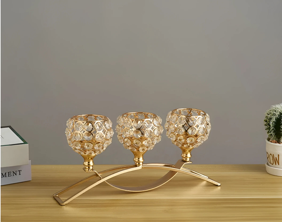 Crystal geometric candle holder with electroplated gold finish on wrought iron base
