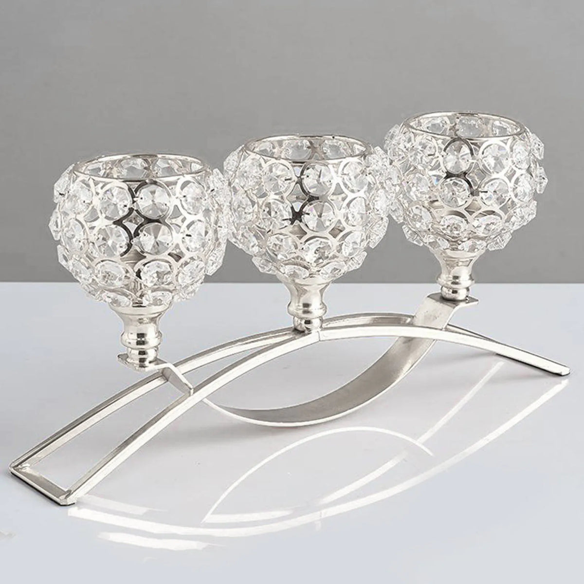 Crystal geometric candle holder with electroplated gold finish on wrought iron base