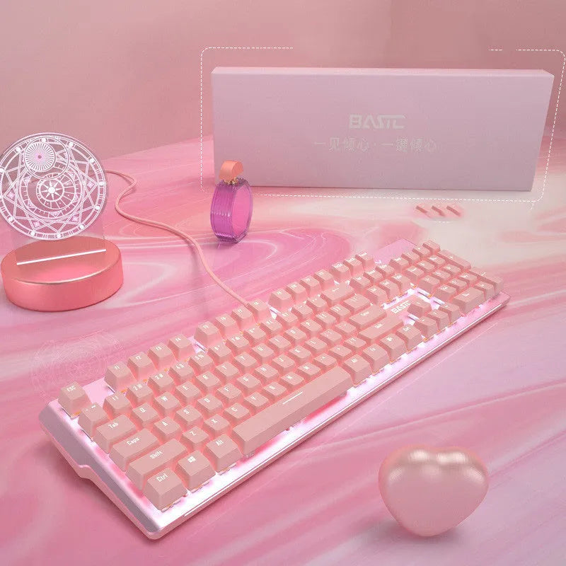 Pink wired mechanical keyboard and matching gaming mouse set on a desk.