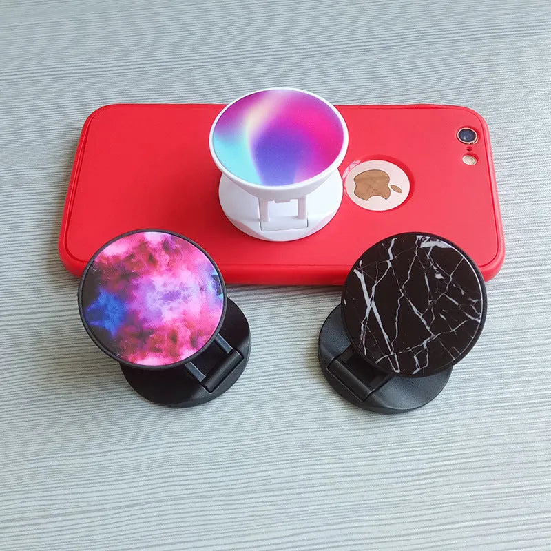 Folding mobile phone holder with thermal transfer aluminium sheet option in multiple colours on desktop