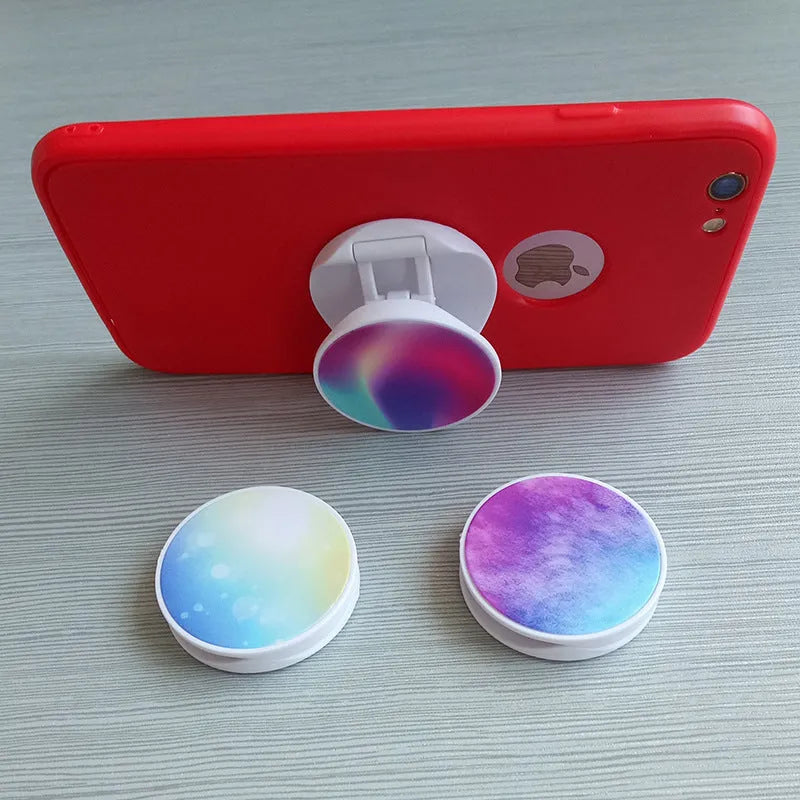 Folding mobile phone holder with thermal transfer aluminium sheet option in multiple colours on desktop
