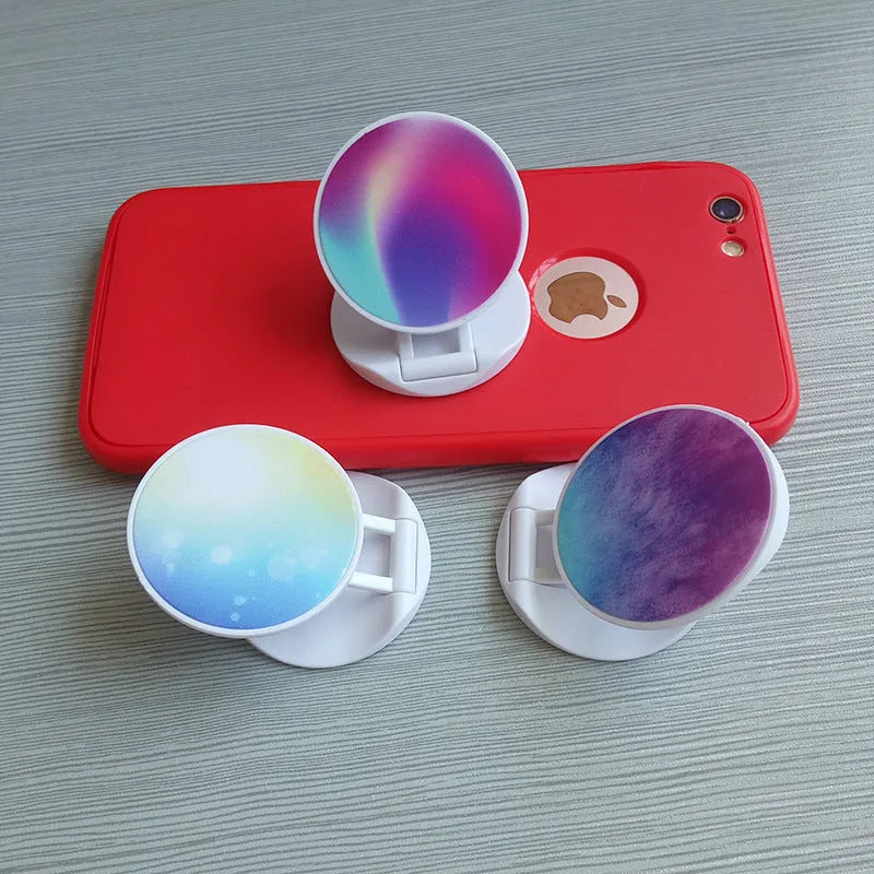 Folding mobile phone holder with thermal transfer aluminium sheet option in multiple colours on desktop