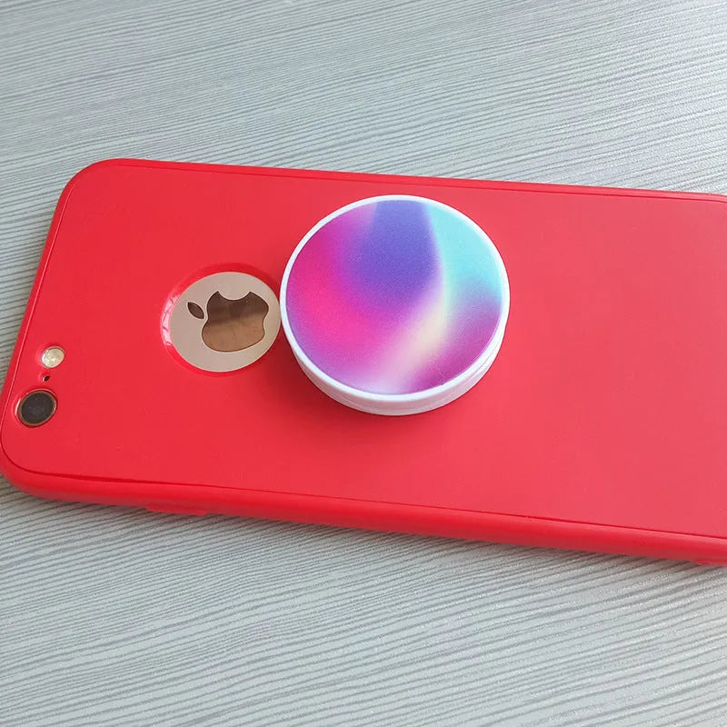 Folding mobile phone holder with thermal transfer aluminium sheet option in multiple colours on desktop
