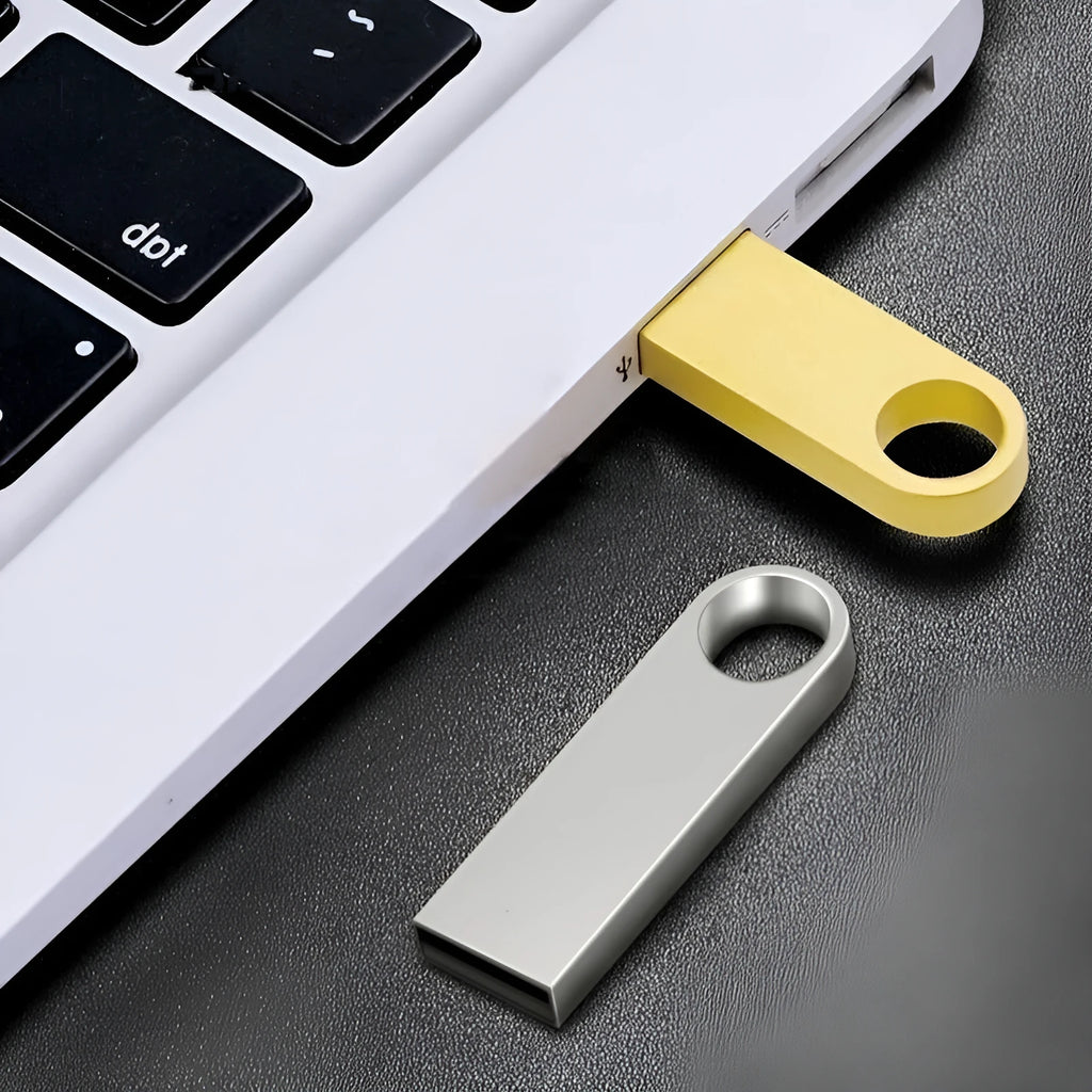 Gold metal USB 2.0 flash drive with compact rectangular shape on light background
