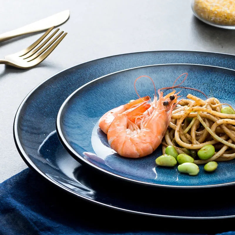 Blue Kiln Variation European-style porcelain shallow plate, 10 inch (25.2 cm) on table