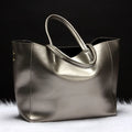 Women's cowhide leather shoulder handbag in silver, bronze, wine red, blue, or black colour