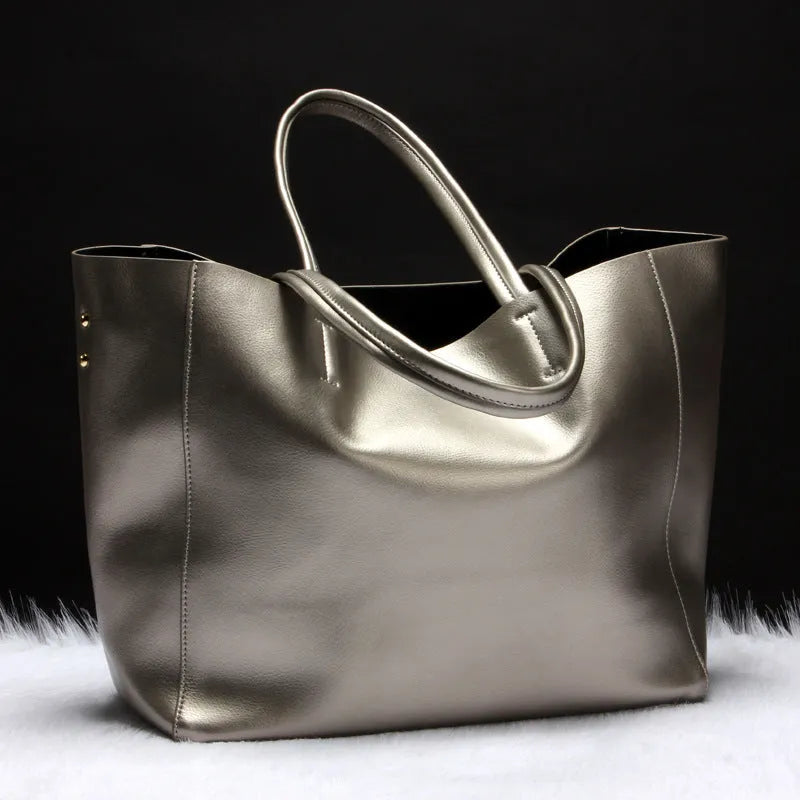 Women's cowhide leather shoulder handbag in silver, bronze, wine red, blue, or black colour