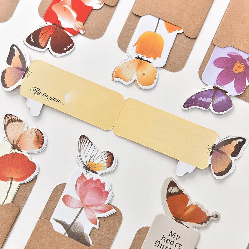 Butterfly-shaped paper bookmark measuring 13.5cm by 5.5cm with creative stationery design