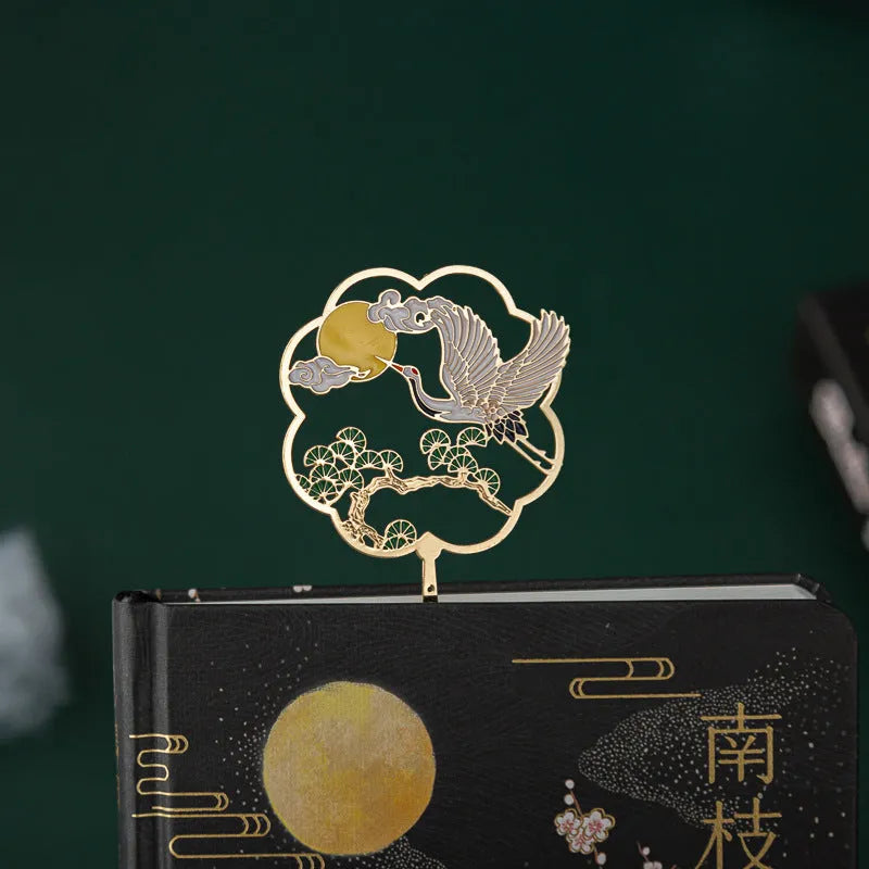 Chinese style metal feather pen with assortment of coloured feather nibs and matching notebook.