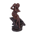 Red handmade ceramic snail-shaped backflow incense burner on a table