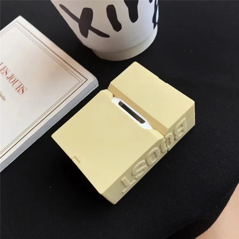 Solid colour silicone protective sleeve for AirPods 1 and 2 with a metal carabiner clip attached.